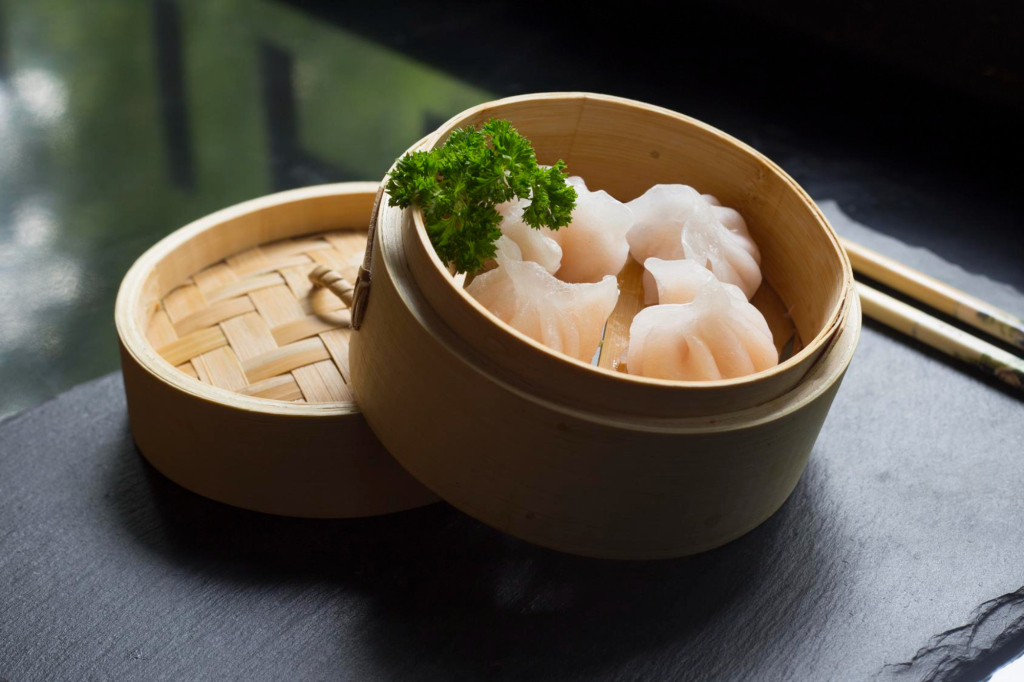 An appetizing assortment of steamed and fried dim sum dishes, including dumplings, beautifully presented on a plate